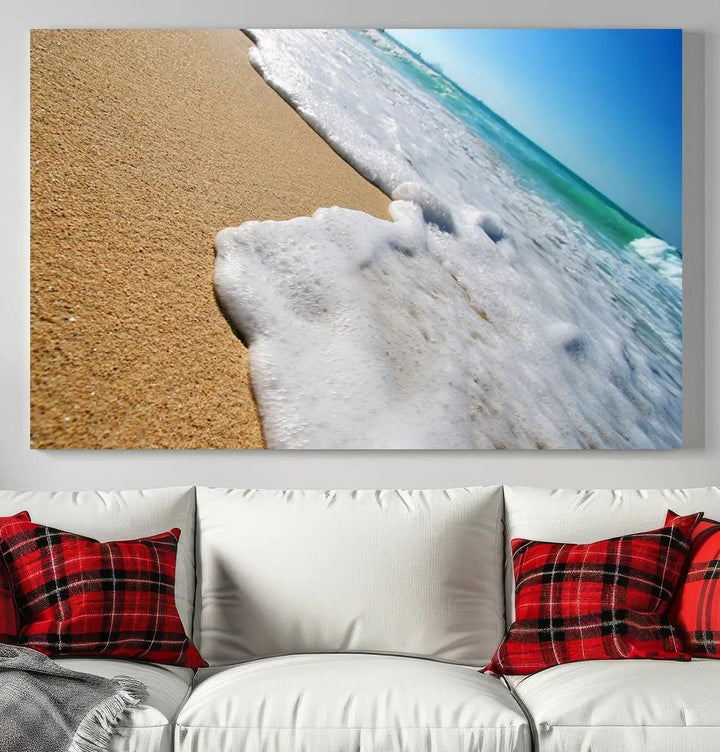 Sandy shoreline close-up ocean wave canvas print. Beach wall art with giclee canvas and gallery wrap, perfect for coastal living decor.