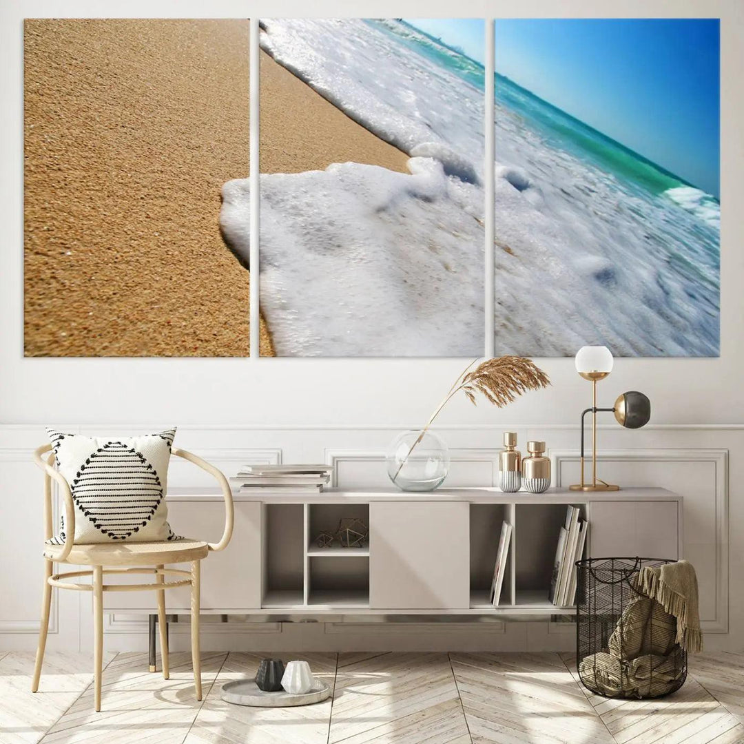 Sandy shoreline close-up ocean wave canvas print. Beach wall art with giclee canvas and gallery wrap, perfect for coastal living decor.