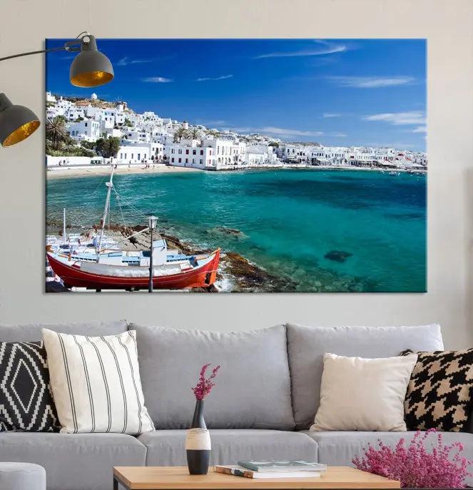 The Santorini Wall Art Canvas Print, showcasing a triptych of a coastal Greek village with white buildings and a turquoise sea, enhances the modern living room.