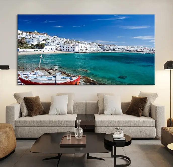 The Santorini Wall Art Canvas Print, showcasing a triptych of a coastal Greek village with white buildings and a turquoise sea, enhances the modern living room.