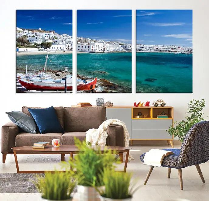 The Santorini Wall Art Canvas Print, showcasing a triptych of a coastal Greek village with white buildings and a turquoise sea, enhances the modern living room.