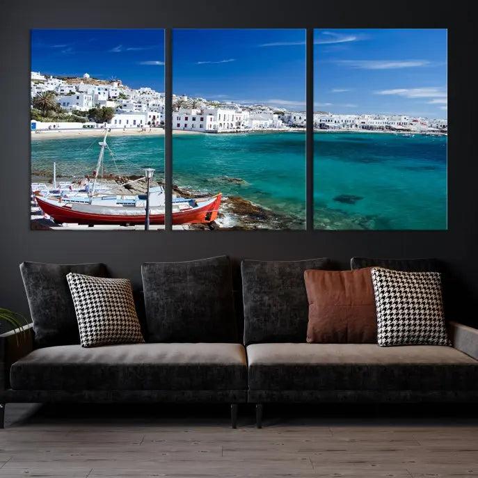 The Santorini Wall Art Canvas Print, showcasing a triptych of a coastal Greek village with white buildings and a turquoise sea, enhances the modern living room.