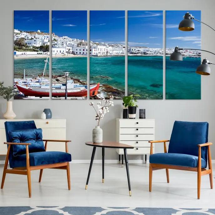 The Santorini Wall Art Canvas Print, showcasing a triptych of a coastal Greek village with white buildings and a turquoise sea, enhances the modern living room.