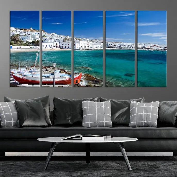 The Santorini Wall Art Canvas Print, showcasing a triptych of a coastal Greek village with white buildings and a turquoise sea, enhances the modern living room.