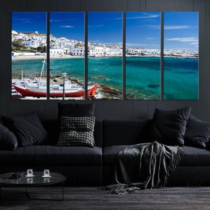 The Santorini Wall Art Canvas Print, showcasing a triptych of a coastal Greek village with white buildings and a turquoise sea, enhances the modern living room.