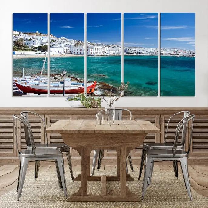 The Santorini Wall Art Canvas Print, showcasing a triptych of a coastal Greek village with white buildings and a turquoise sea, enhances the modern living room.