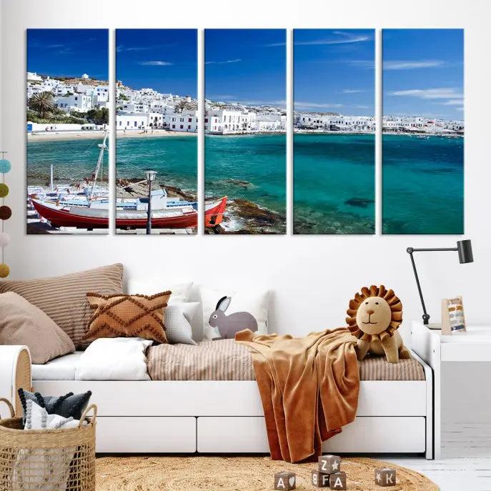 The Santorini Wall Art Canvas Print, showcasing a triptych of a coastal Greek village with white buildings and a turquoise sea, enhances the modern living room.