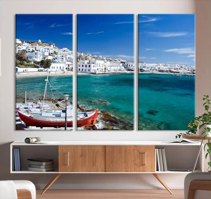 The Santorini Wall Art Canvas Print, showcasing a triptych of a coastal Greek village with white buildings and a turquoise sea, enhances the modern living room.