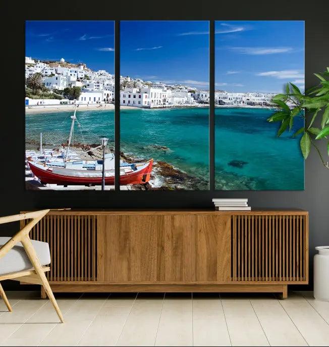 The Santorini Wall Art Canvas Print, showcasing a triptych of a coastal Greek village with white buildings and a turquoise sea, enhances the modern living room.