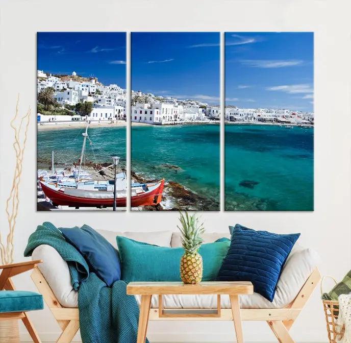 The Santorini Wall Art Canvas Print, showcasing a triptych of a coastal Greek village with white buildings and a turquoise sea, enhances the modern living room.