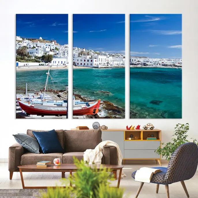 The Santorini Wall Art Canvas Print, showcasing a triptych of a coastal Greek village with white buildings and a turquoise sea, enhances the modern living room.