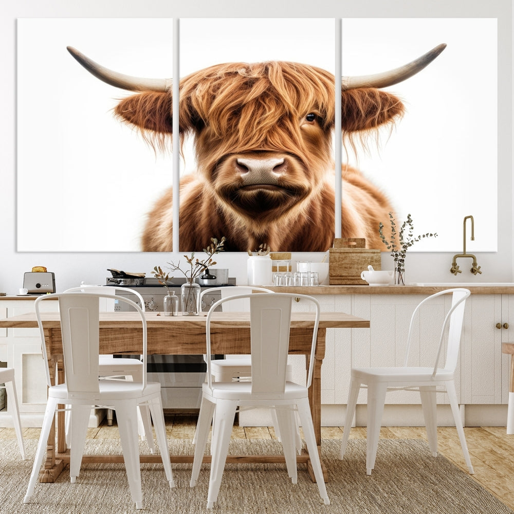 A Scottish Highland Cow Canvas Print, featuring a trio of panels depicting a long-haired, large-horned Highland cow on museum-quality canvas with UV protection, was displayed.