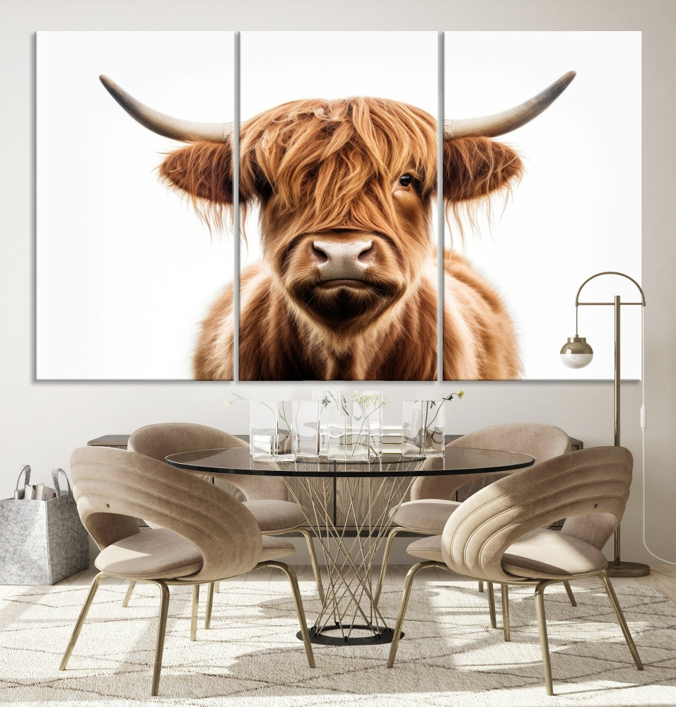 A Scottish Highland Cow Canvas Print, featuring a trio of panels depicting a long-haired, large-horned Highland cow on museum-quality canvas with UV protection, was displayed.