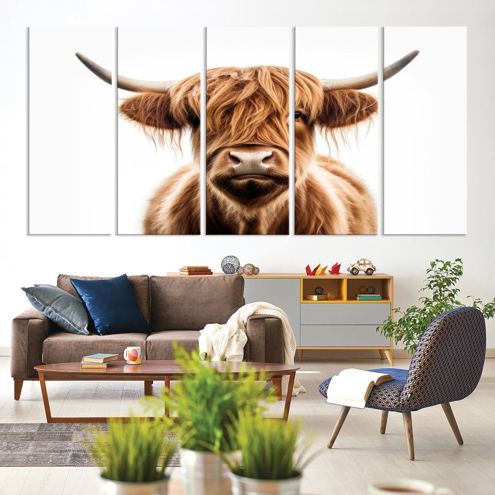 A Scottish Highland Cow Canvas Print, featuring a trio of panels depicting a long-haired, large-horned Highland cow on museum-quality canvas with UV protection, was displayed.