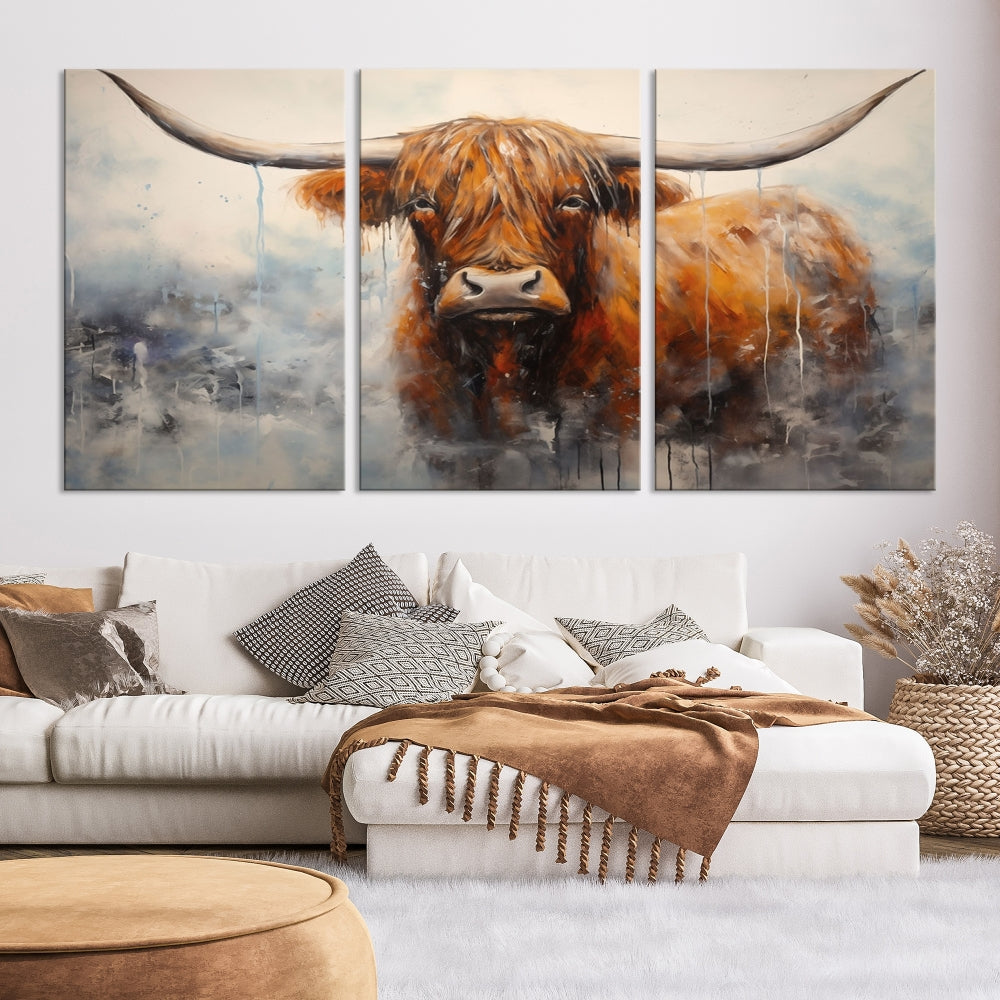 The stunning Scottish Highland Cow Canvas Wall Art enhances the room with its rustic decor. Its three-panel design features a longhorn animal theme, creating a striking presence on the dark wall.