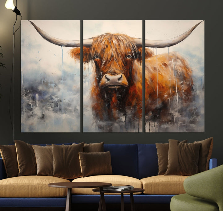 The stunning Scottish Highland Cow Canvas Wall Art enhances the room with its rustic decor. Its three-panel design features a longhorn animal theme, creating a striking presence on the dark wall.