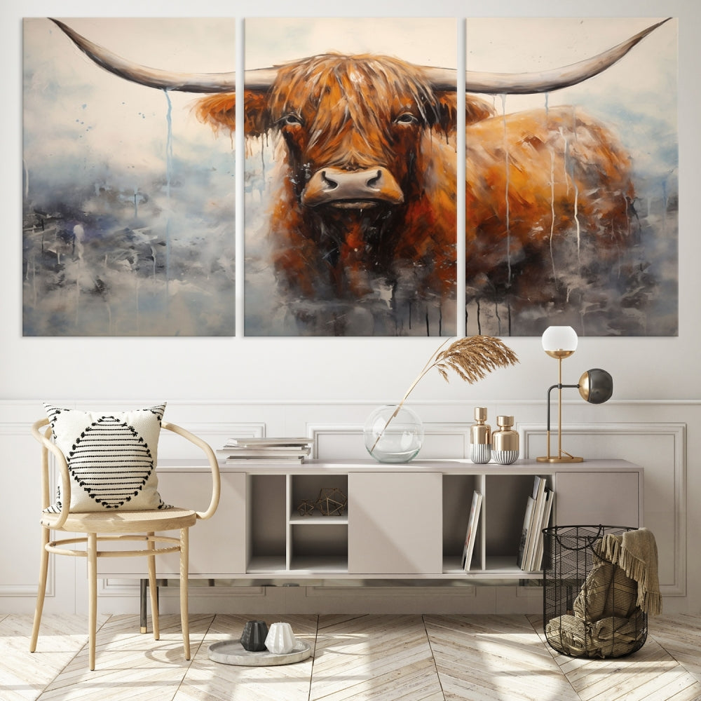 The stunning Scottish Highland Cow Canvas Wall Art enhances the room with its rustic decor. Its three-panel design features a longhorn animal theme, creating a striking presence on the dark wall.