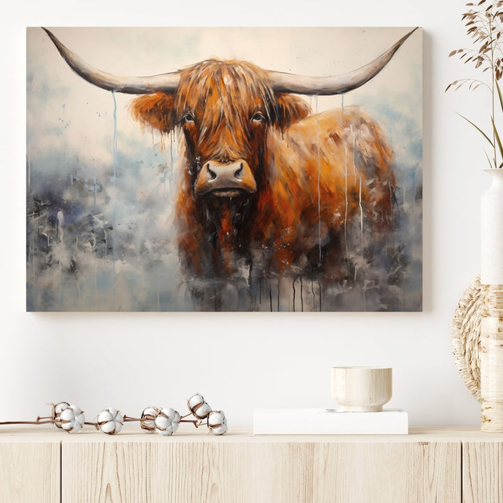 The stunning Scottish Highland Cow Canvas Wall Art enhances the room with its rustic decor. Its three-panel design features a longhorn animal theme, creating a striking presence on the dark wall.