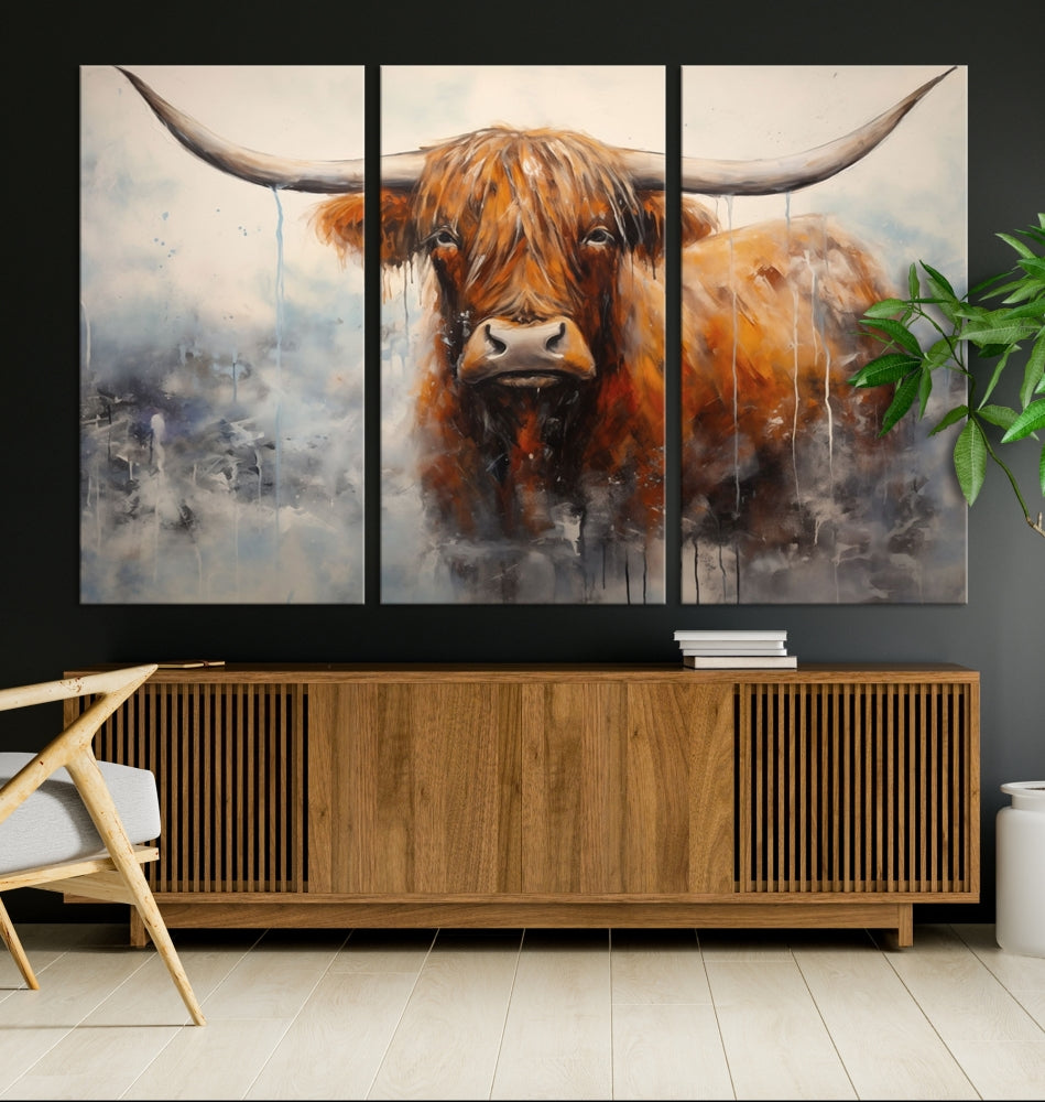 The stunning Scottish Highland Cow Canvas Wall Art enhances the room with its rustic decor. Its three-panel design features a longhorn animal theme, creating a striking presence on the dark wall.