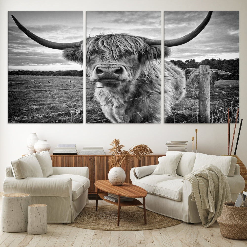 The "Scottish Highland Cow Canvas Wall Art Farmhouse Decor" adds a touch of rustic charm to your living room wall above the couch.