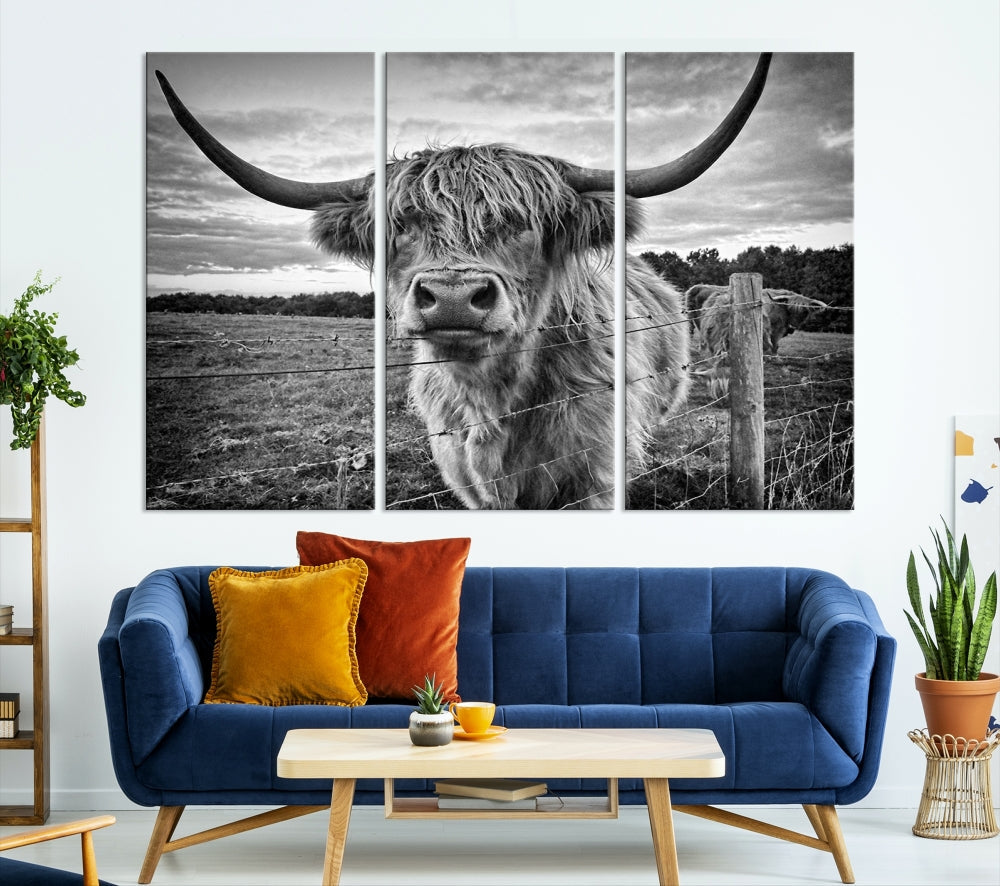 The "Scottish Highland Cow Canvas Wall Art Farmhouse Decor" adds a touch of rustic charm to your living room wall above the couch.