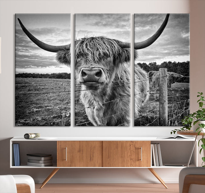 The "Scottish Highland Cow Canvas Wall Art Farmhouse Decor" adds a touch of rustic charm to your living room wall above the couch.