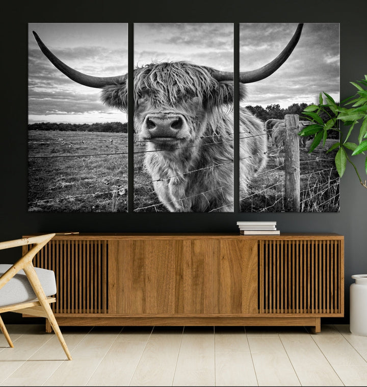 The "Scottish Highland Cow Canvas Wall Art Farmhouse Decor" adds a touch of rustic charm to your living room wall above the couch.