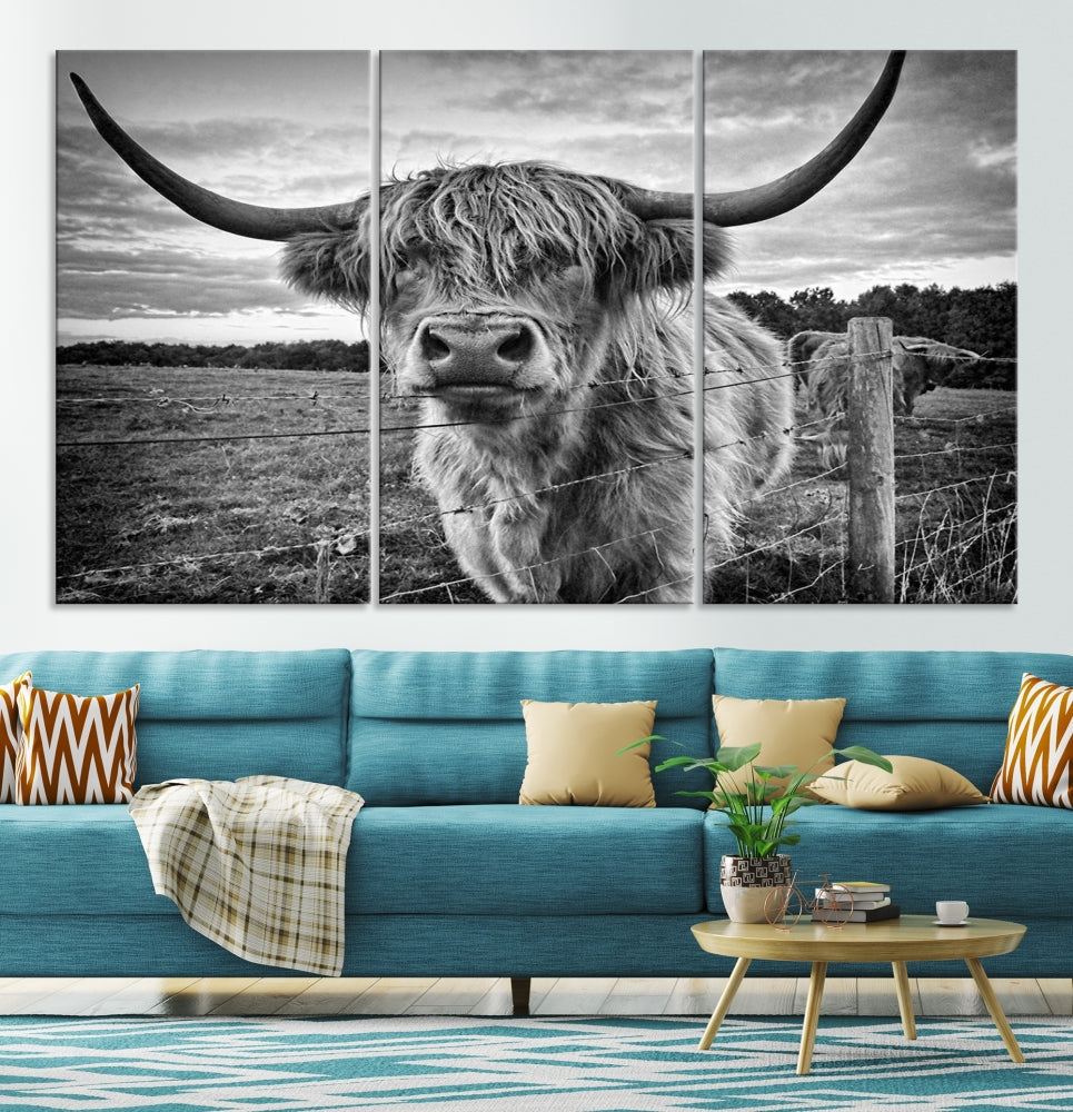 The "Scottish Highland Cow Canvas Wall Art Farmhouse Decor" adds a touch of rustic charm to your living room wall above the couch.