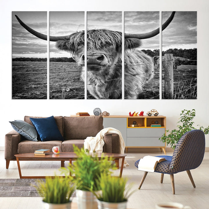 The "Scottish Highland Cow Canvas Wall Art Farmhouse Decor" adds a touch of rustic charm to your living room wall above the couch.