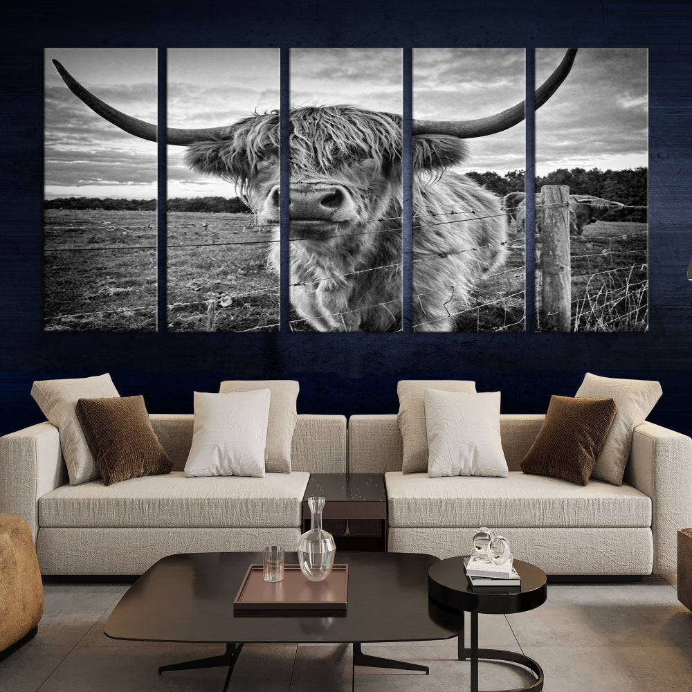 The "Scottish Highland Cow Canvas Wall Art Farmhouse Decor" adds a touch of rustic charm to your living room wall above the couch.