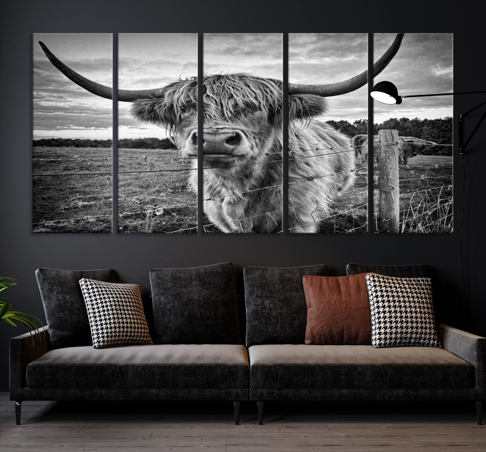 The "Scottish Highland Cow Canvas Wall Art Farmhouse Decor" adds a touch of rustic charm to your living room wall above the couch.