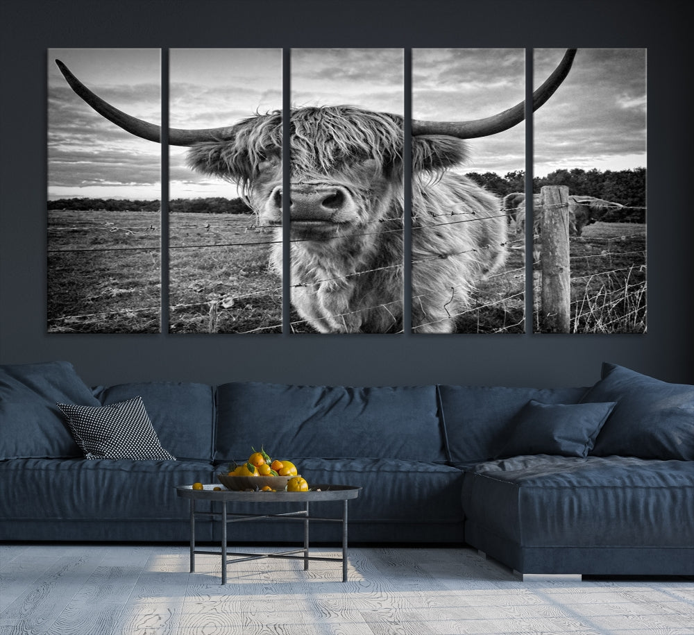 The "Scottish Highland Cow Canvas Wall Art Farmhouse Decor" adds a touch of rustic charm to your living room wall above the couch.