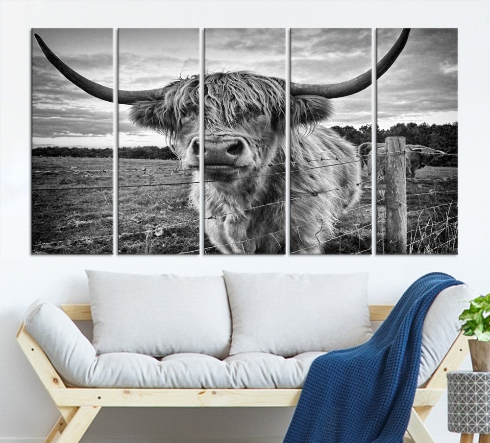 The "Scottish Highland Cow Canvas Wall Art Farmhouse Decor" adds a touch of rustic charm to your living room wall above the couch.