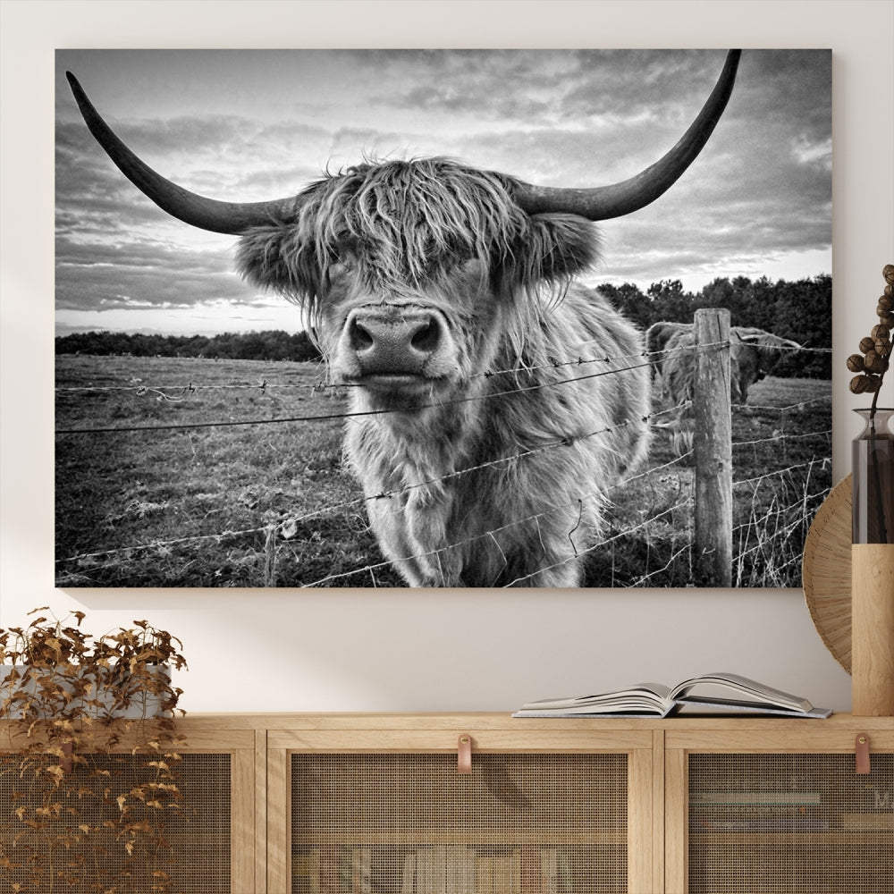 The "Scottish Highland Cow Canvas Wall Art Farmhouse Decor" adds a touch of rustic charm to your living room wall above the couch.