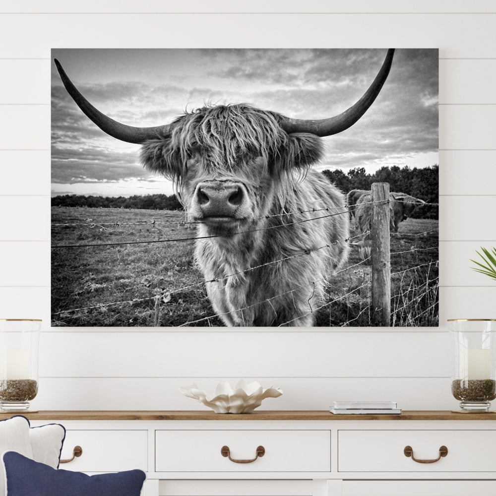 The "Scottish Highland Cow Canvas Wall Art Farmhouse Decor" adds a touch of rustic charm to your living room wall above the couch.