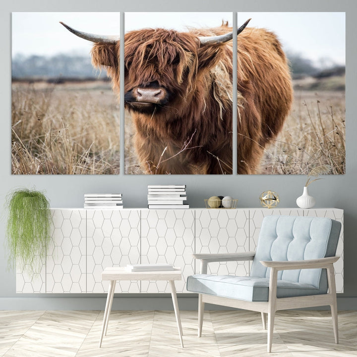 The modern farmhouse aesthetic comes to life with the Scottish Highland Cow Canvas Wall Art, featuring rustic charm and a breathtaking depiction of highland cattle in a natural setting.