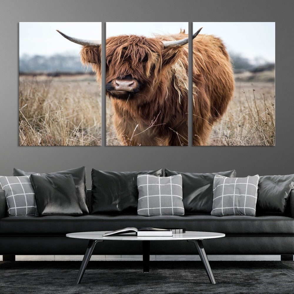 The modern farmhouse aesthetic comes to life with the Scottish Highland Cow Canvas Wall Art, featuring rustic charm and a breathtaking depiction of highland cattle in a natural setting.