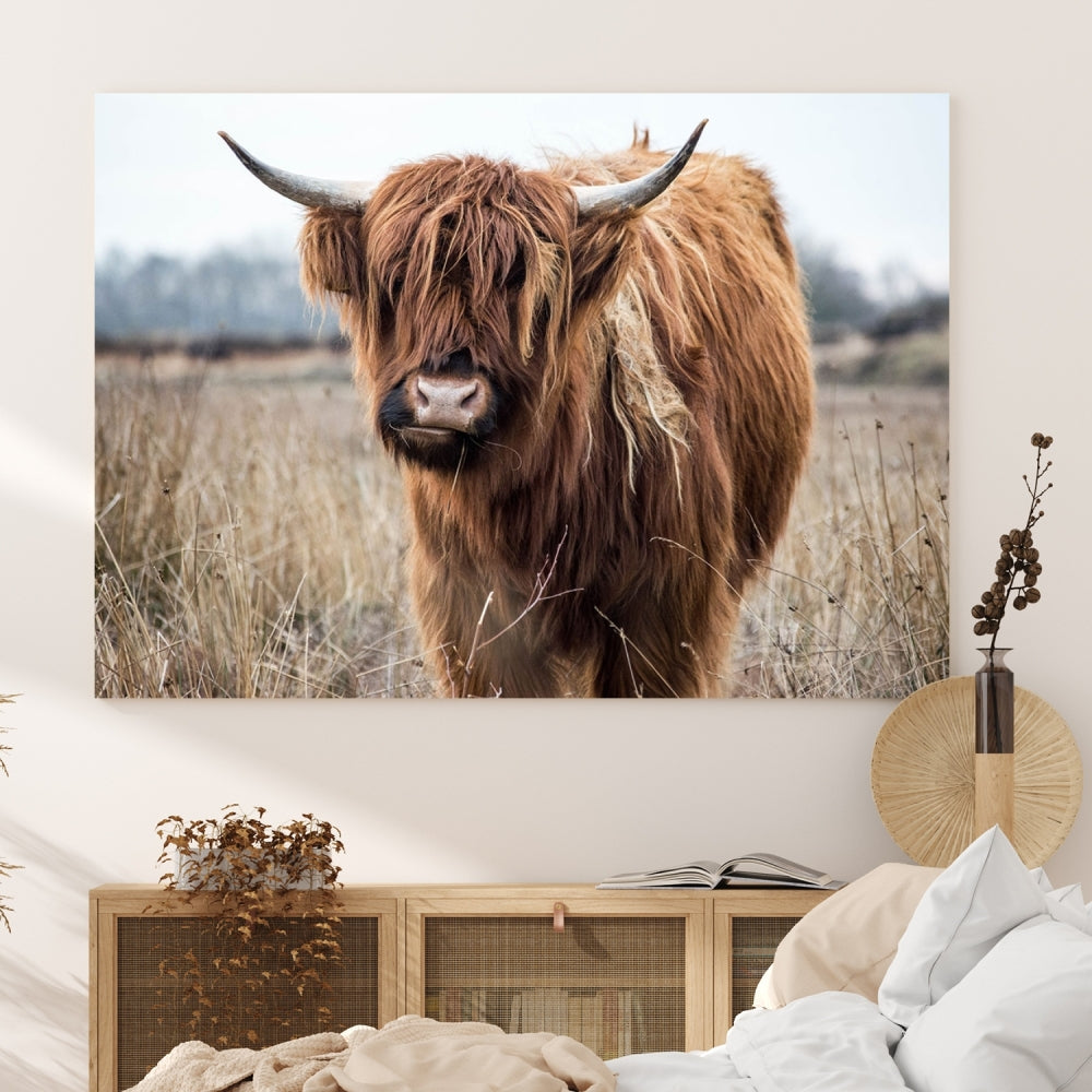 The modern farmhouse aesthetic comes to life with the Scottish Highland Cow Canvas Wall Art, featuring rustic charm and a breathtaking depiction of highland cattle in a natural setting.