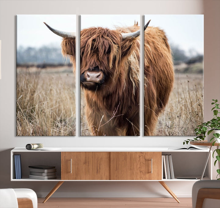 The modern farmhouse aesthetic comes to life with the Scottish Highland Cow Canvas Wall Art, featuring rustic charm and a breathtaking depiction of highland cattle in a natural setting.