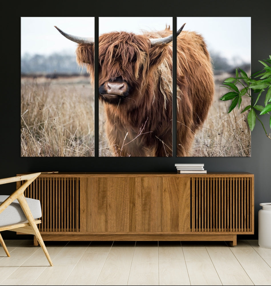 The modern farmhouse aesthetic comes to life with the Scottish Highland Cow Canvas Wall Art, featuring rustic charm and a breathtaking depiction of highland cattle in a natural setting.