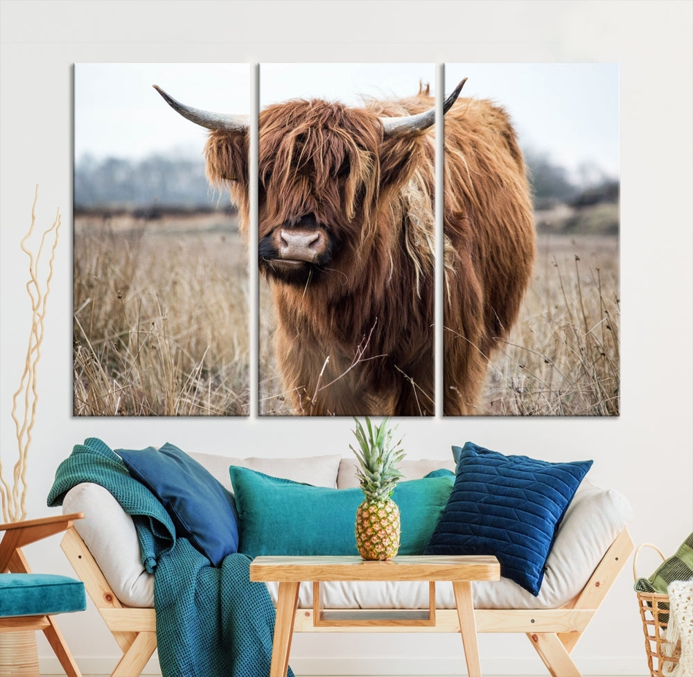 The modern farmhouse aesthetic comes to life with the Scottish Highland Cow Canvas Wall Art, featuring rustic charm and a breathtaking depiction of highland cattle in a natural setting.