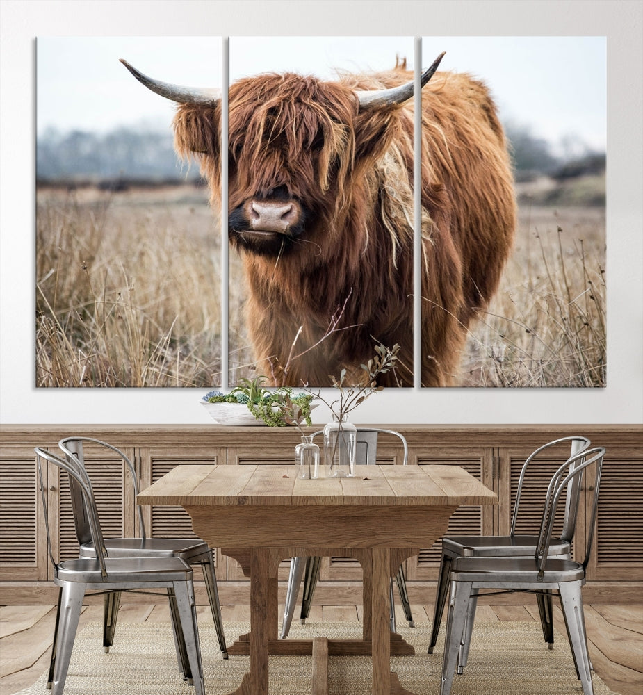 The modern farmhouse aesthetic comes to life with the Scottish Highland Cow Canvas Wall Art, featuring rustic charm and a breathtaking depiction of highland cattle in a natural setting.