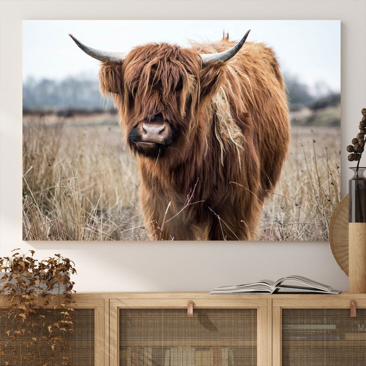 The modern farmhouse aesthetic comes to life with the Scottish Highland Cow Canvas Wall Art, featuring rustic charm and a breathtaking depiction of highland cattle in a natural setting.