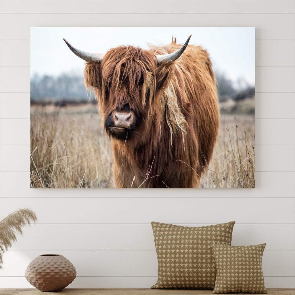 The modern farmhouse aesthetic comes to life with the Scottish Highland Cow Canvas Wall Art, featuring rustic charm and a breathtaking depiction of highland cattle in a natural setting.