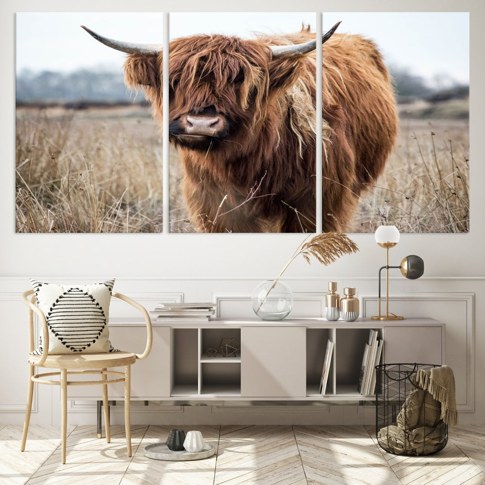 The modern farmhouse aesthetic comes to life with the Scottish Highland Cow Canvas Wall Art, featuring rustic charm and a breathtaking depiction of highland cattle in a natural setting.