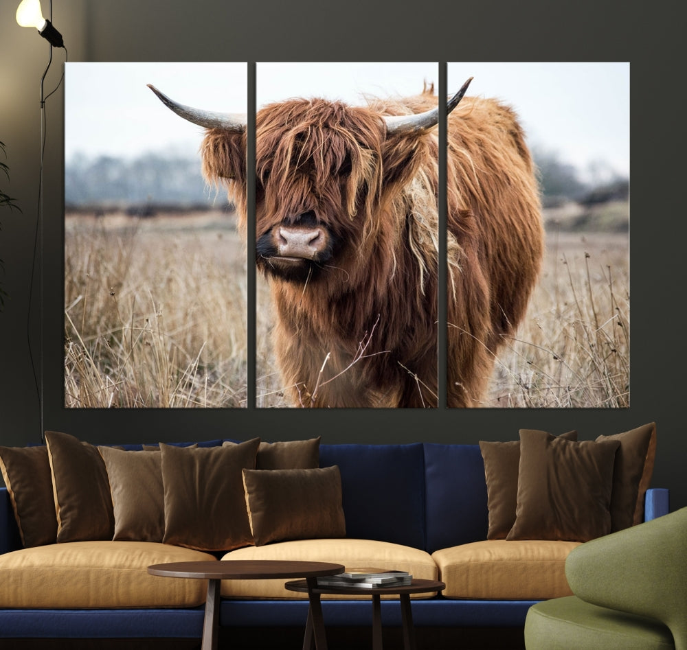 The modern farmhouse aesthetic comes to life with the Scottish Highland Cow Canvas Wall Art, featuring rustic charm and a breathtaking depiction of highland cattle in a natural setting.