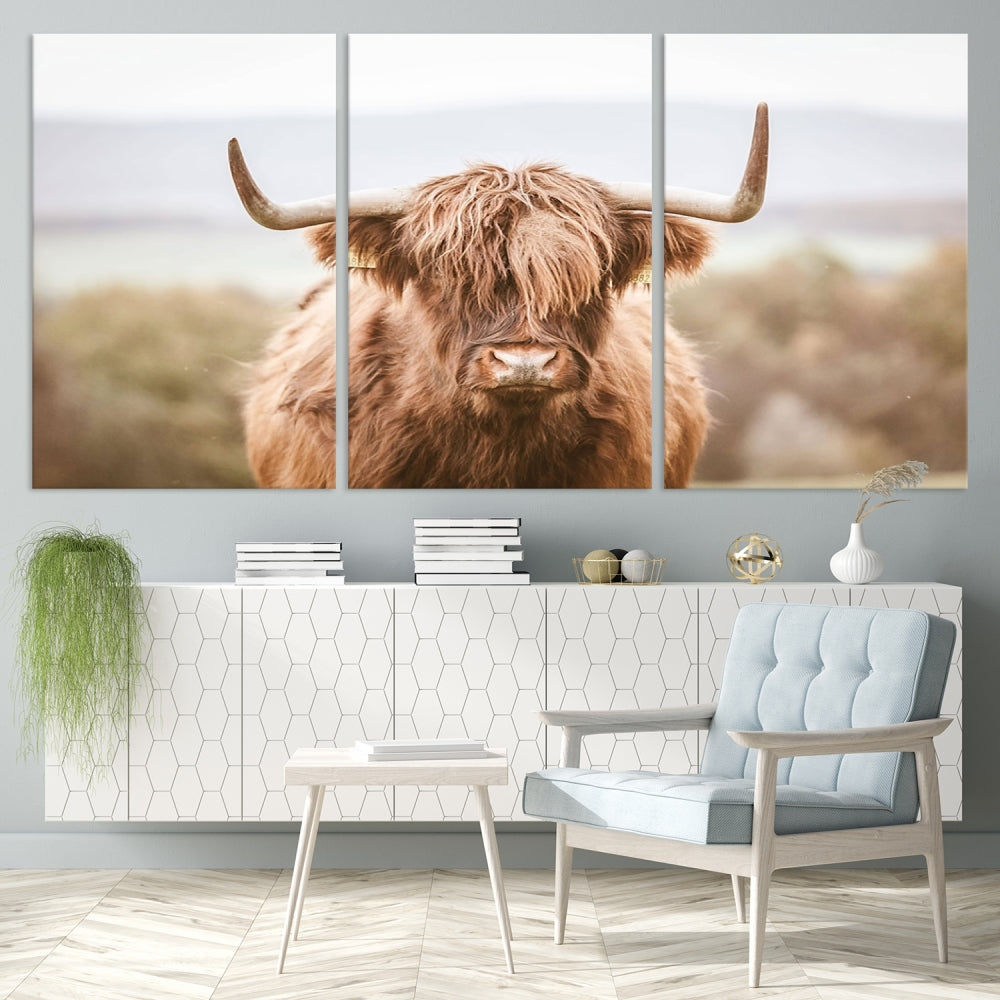 Canvas wall art featuring a Highland cow with long, shaggy fur in natural pastel tones, ready to hang.