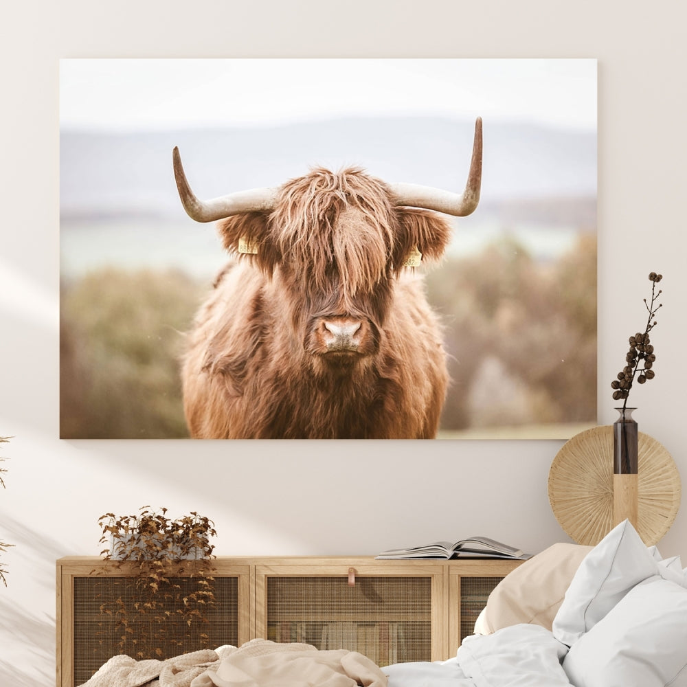 Canvas wall art featuring a Highland cow with long, shaggy fur in natural pastel tones, ready to hang.