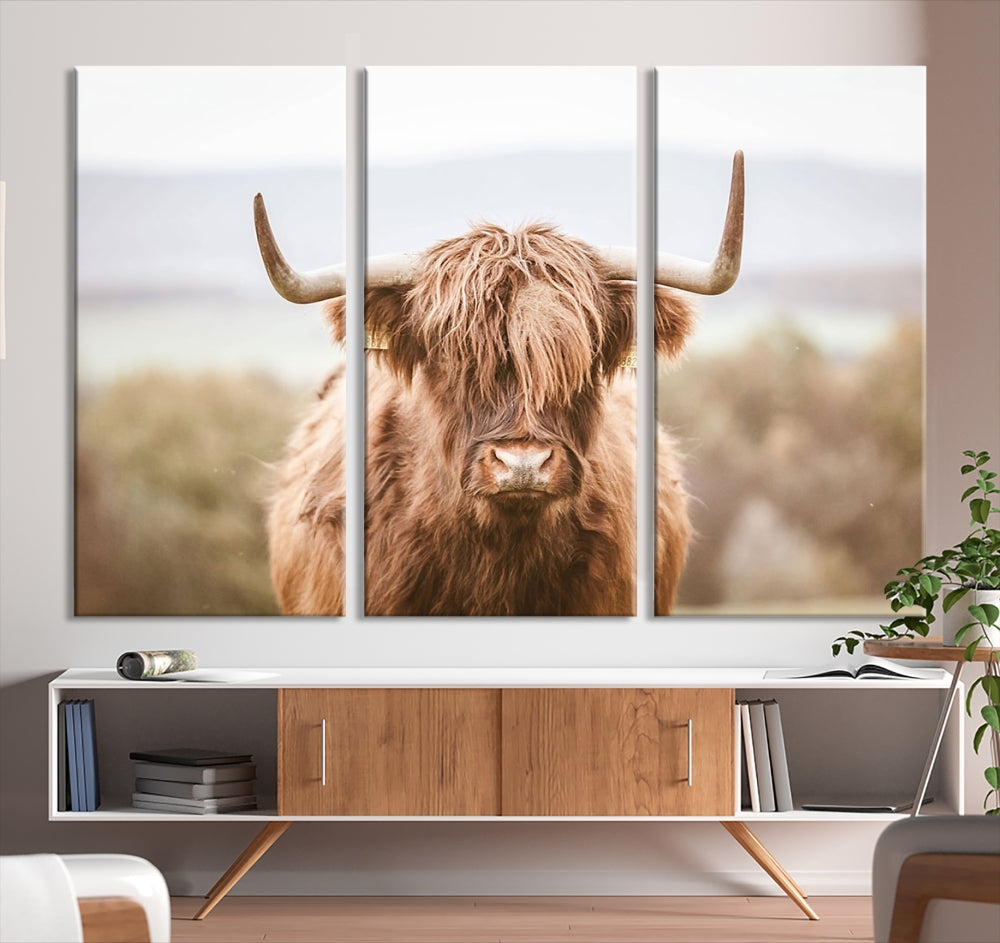 Canvas wall art featuring a Highland cow with long, shaggy fur in natural pastel tones, ready to hang.