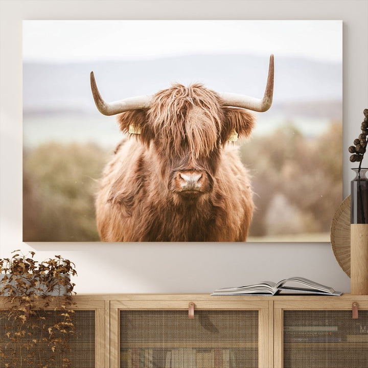 Canvas wall art featuring a Highland cow with long, shaggy fur in natural pastel tones, ready to hang.